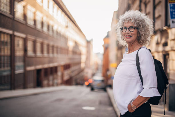 istock Curly haired woman on the street 1184604480