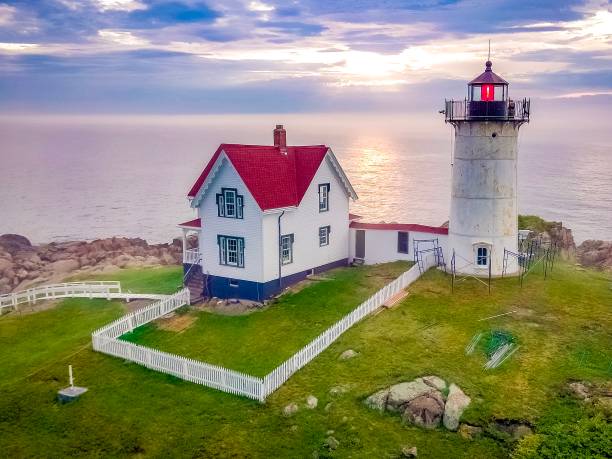 Nubble light house York, ME This picture away taken with a drone on a beautiful summer day. lighthouse maine new england coastline stock pictures, royalty-free photos & images