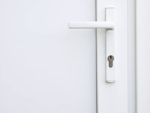 istock Handle of a closed white plastic door 1184605348