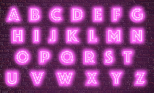 Alphabet in neon against a brick wall graphics