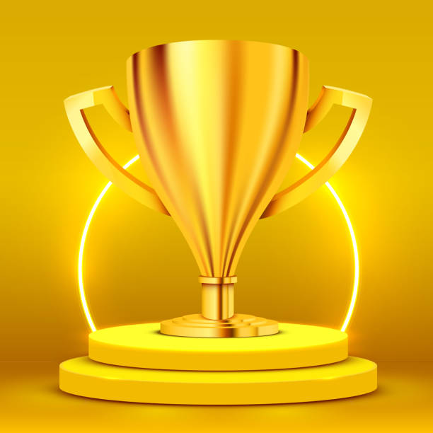 istock Realistic Golden Trophy on round podium with illuminated with spotlight. Award ceremony concept. Stage backdrop. 1184609650