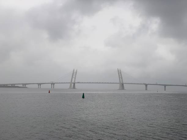 istock Cable-stayed bridge across the river on a summer cloudy day 1184613865