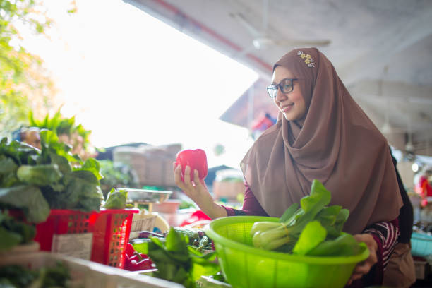 istock Choosing vegetables in market 1184616338