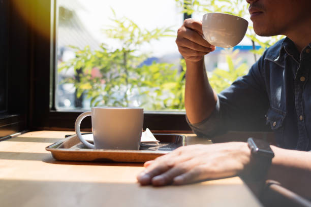 istock man drinking a coffee at the cafe 1184617432