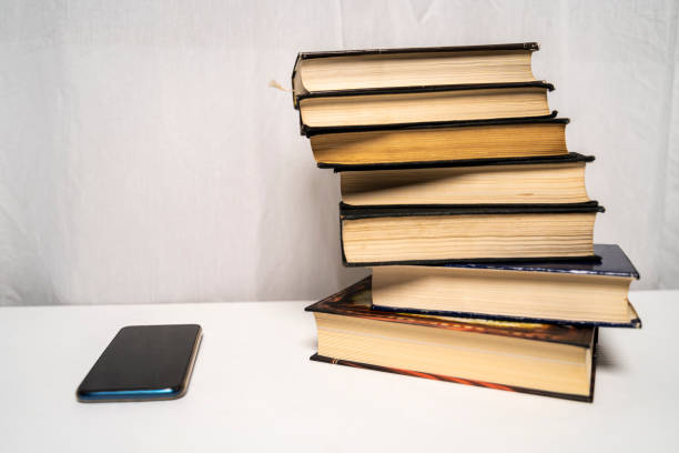 istock New smart phone vs stack of books 1184617479