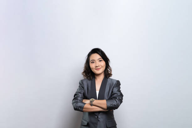 istock Happy woman thinking and standing isolated over white background 1184617609