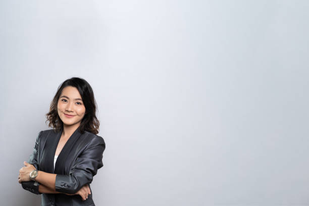 istock Happy woman thinking and standing isolated over white background 1184618187