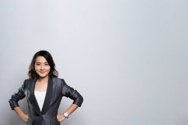 istock Happy woman thinking and standing isolated over white background 1184618598