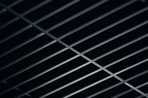 istock Office grille ceiling. Modern black metal grille ceiling, suspended covering. Abstract design texture. 1184619966