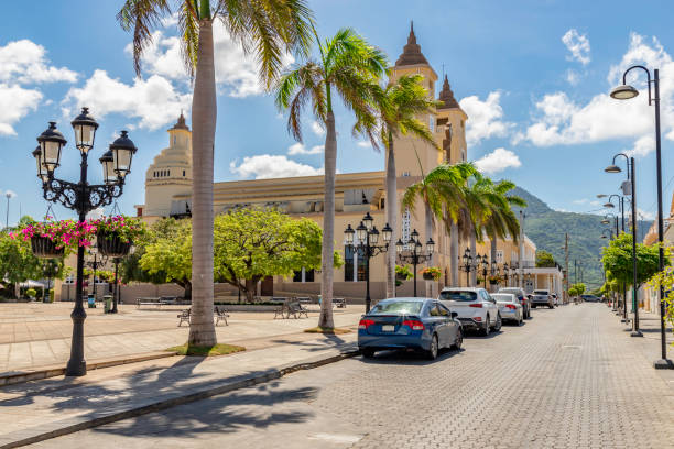 Independence Square, Plaza de Independencia, catholic church in the center of the city Caribbean old city street, church, independence square, tropical plants , palm tree, mountain view, Puerto Plata, Dominican Republic puerto plata stock pictures, royalty-free photos & images