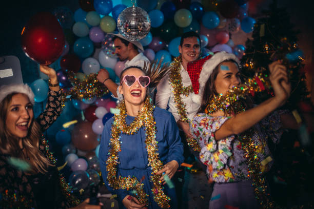 Group of friends having a new year party  and dancing