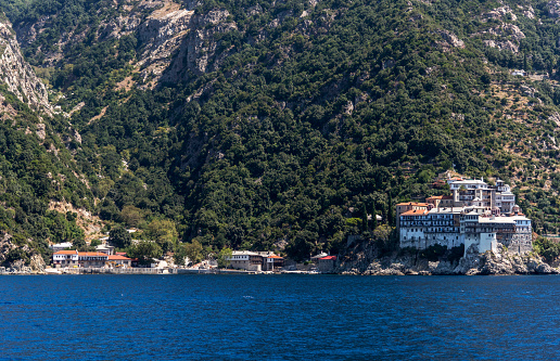 Osiou Gregoriou monastery from the sea in Halkidiki, Athos, Greece.