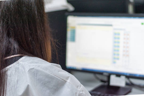 istock Scientist in white gown uniform working in university research laboratory.Lab technologist work with computer data collection in lab room hospital. 1184622337
