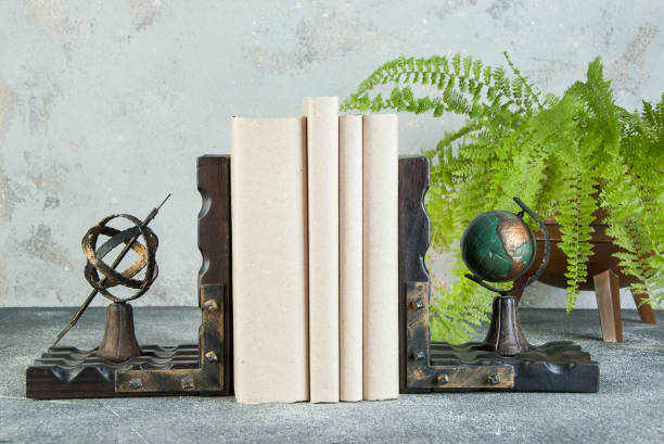 istock Antique book ends on a gray background 1184623262