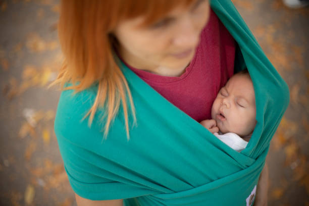 istock Newborn sleeping in baby carrier 1184623398