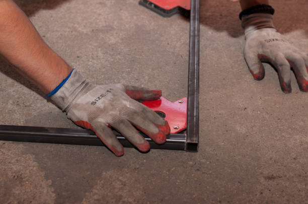 istock Measurement and welding tool. The worker welds a metal structure. 1184623534