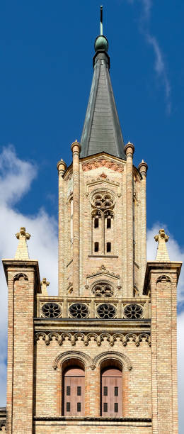 istock old brick church in front of blue sky 1184624117