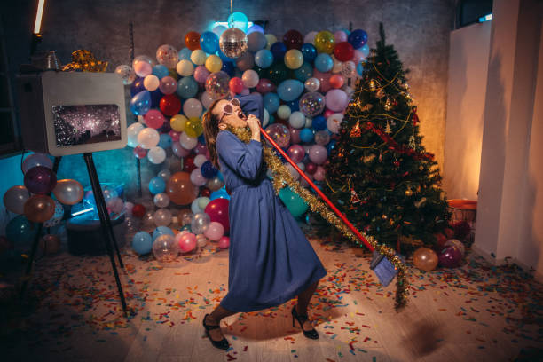 istock Cleaning and dancing after new year party 1184624715