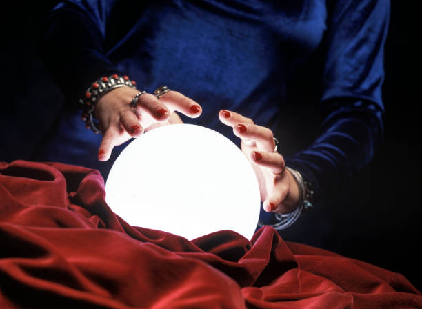 istock hands on glowing crystal ball 1184624786