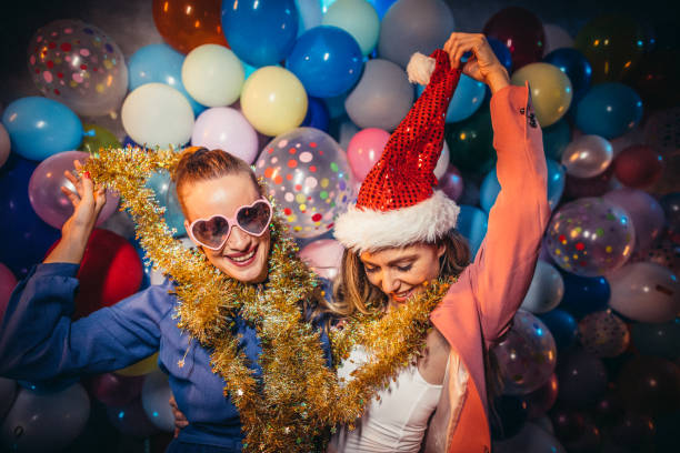 Two friends dancing on the new year party