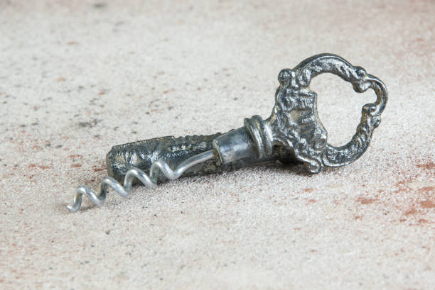 istock Antique corkscrew on concrete background 1184628824