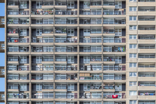 Exterior of London high rise trellick tower block showing balconies Facade of a Brutalist style tower block, trellick tower, in London trellick tower stock pictures, royalty-free photos & images