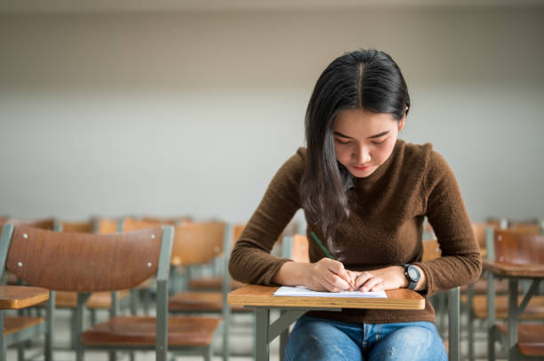 istock Female students taking tests at the university 1184629542