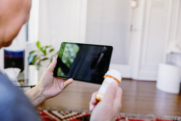istock Senior man refilling prescription medication 1184631147