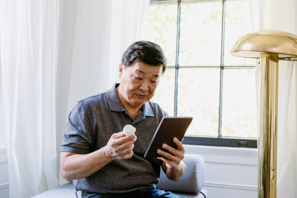 istock Senior man reads about drug side effects on digital tablet 1184631149