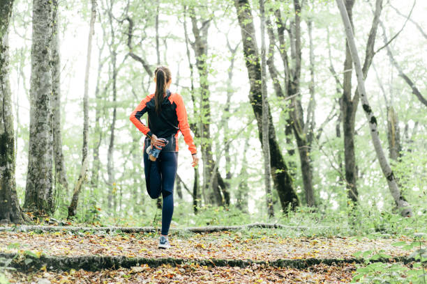 istock Jogger stretches leg muscle with special exercise after jogging 1184631734