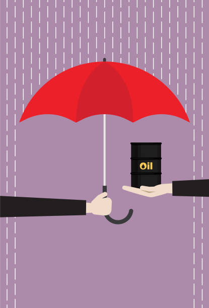 istock Businessman with a red umbrella protecting crude oil from rain 1184632940