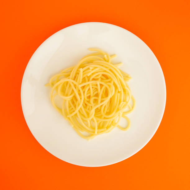 istock pasta, spaghetti or bucatini (ingredients, serving portion of food ). menu concept. food background. copy space. Top view 1184634364