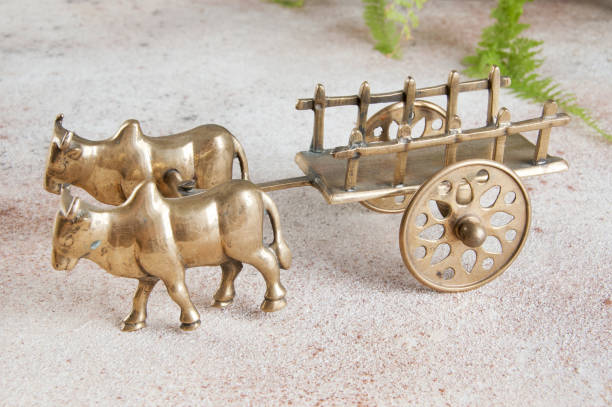 istock Antique bronze ox and cart sculpture 1184637617