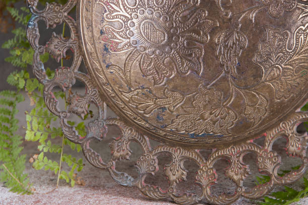 istock Old brass bowl and green plant 1184637647