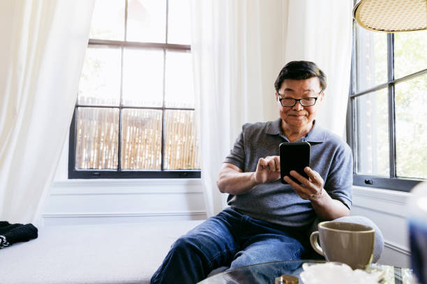 istock Content senior man relaxes at home 1184637897