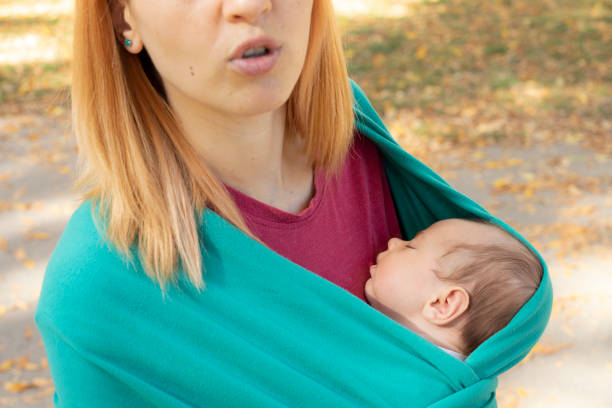 istock Newborn sleeping in baby carrier 1184637905