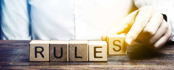 istock The man makes the rules. Setting clear rule and restrictions. Leadership and discipline. Authoritarianism, tight control framework. Patriarchate. Traditions, customs. Norms and laws in society, state 1184639409