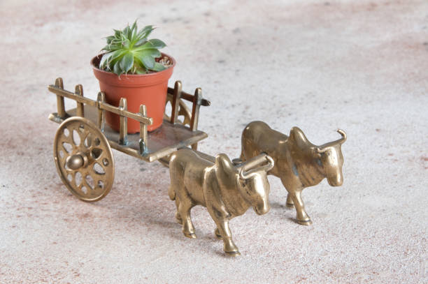istock Antique bronze ox and cart sculpture 1184639514