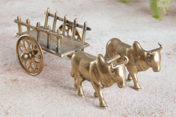istock Antique bronze ox and cart sculpture 1184640265