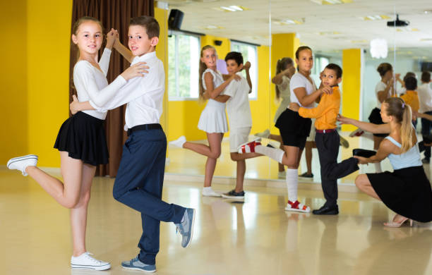 istock Pairs of kids are dancing tango 1184640965