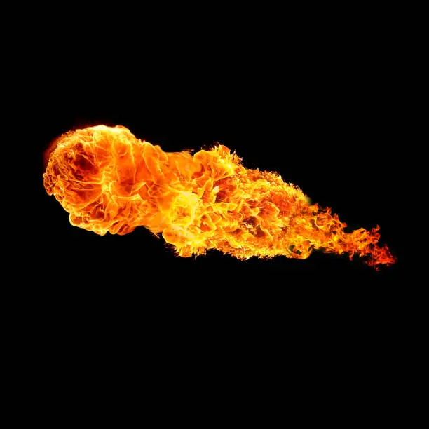 Photo of ball of fire isolated on black background