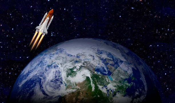 istock Space shuttle orbiting Earth planet. Elements of this image furnished by NASA 1184642473