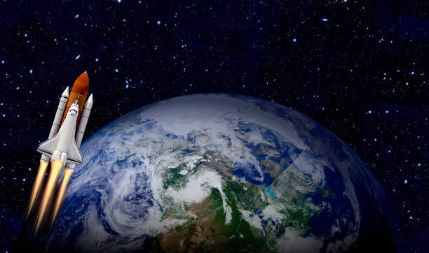 istock Space shuttle orbiting Earth planet. Elements of this image furnished by NASA 1184642474