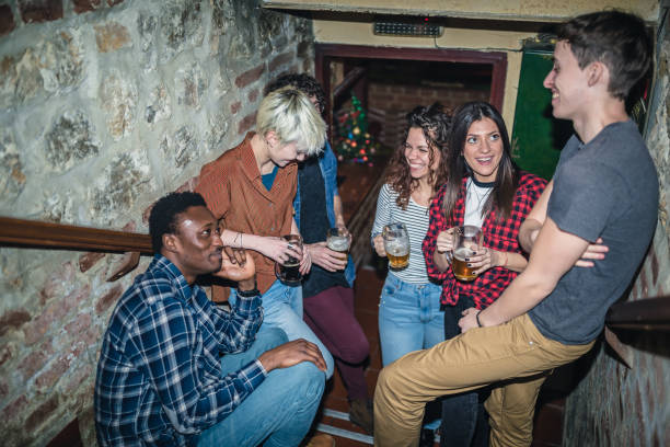 Friends drinking beer in the pub