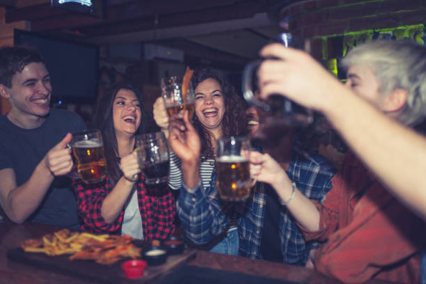 istock Friends drinking beer in the pub 1184645626
