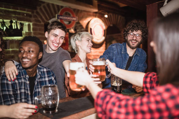 istock Friends drinking beer in the pub 1184645637