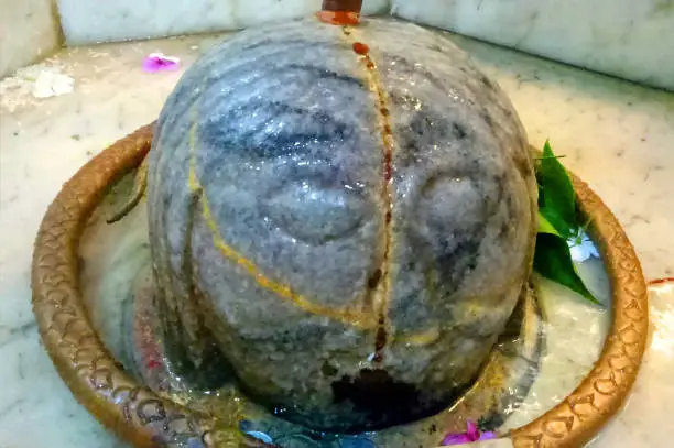 Closeup shot of stone made shivalingam of Lord Shiva in a ancient temple of Rajasthan, India
