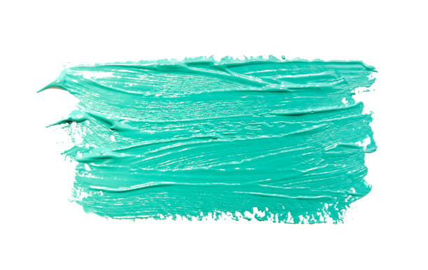 istock Paint brush strokes texture turquoise watercolor isolated on a white 1184650740