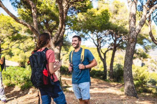 istock Young Spanish Backpacking Couple Resting and Talking 1184651712