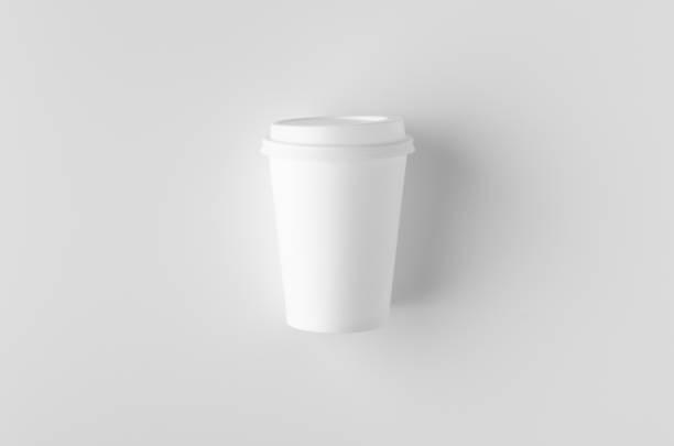 istock Top view of a 12 oz. white coffee paper cup mockup with lid. 1184652610